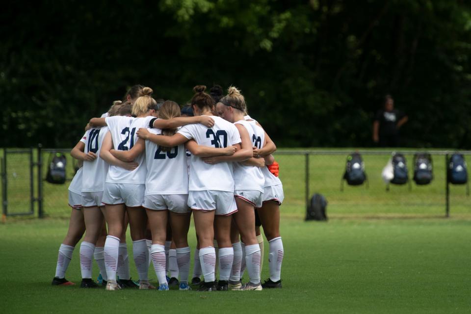 The USI Women’s Soccer team huddles before the first NCAA Division 1 exhibition game against University of Missouri - Kansas City at Strassweg Field in Evansville, Indiana, Sunday afternoon, August 7, 2022.