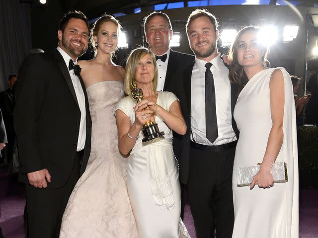 <p>Kevork Djansezian/Getty</p> Jennifer Lawrence with her parents, Karen Lawrence and Gary Lawrence, and brothers, Ben Lawrence and Blaine Lawrence, at the Oscars Governors Ball in February 2013.