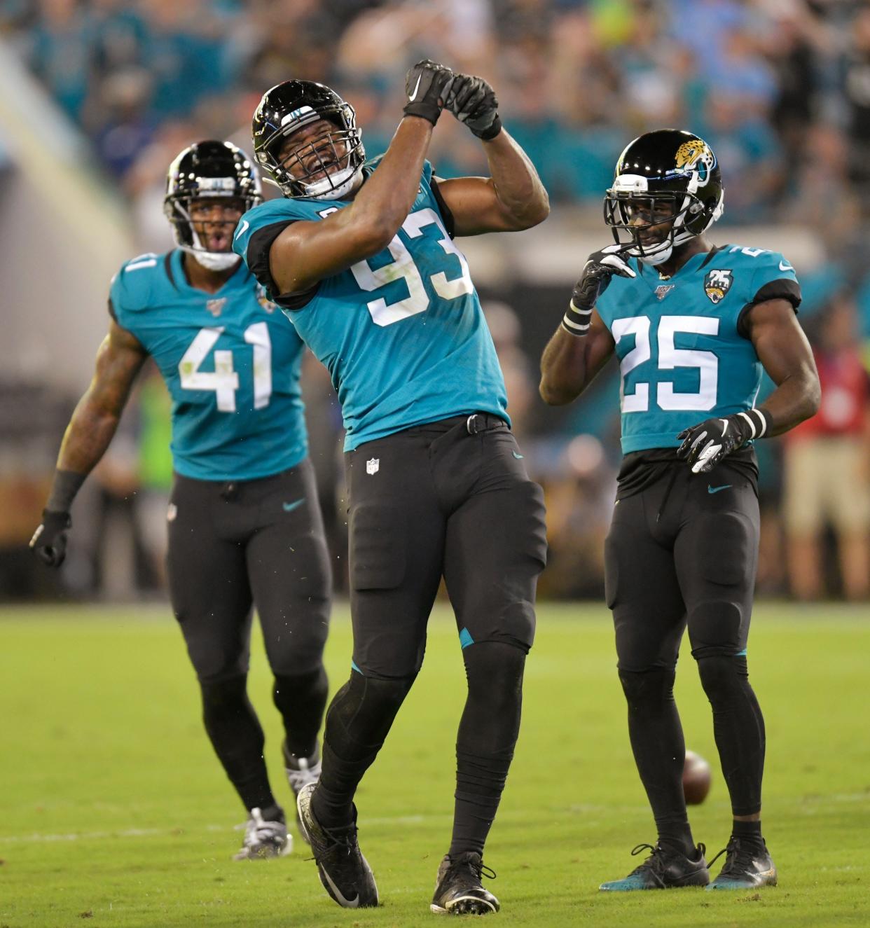 Former Jaguars' defensive lineman Calais Campbell (93), seen here celebrating a sack against the Tennessee Titans in 2019, makes his return to TIAA Bank Field Sunday for the Baltimore Ravens as the NFL's oldest at his position at age 36.