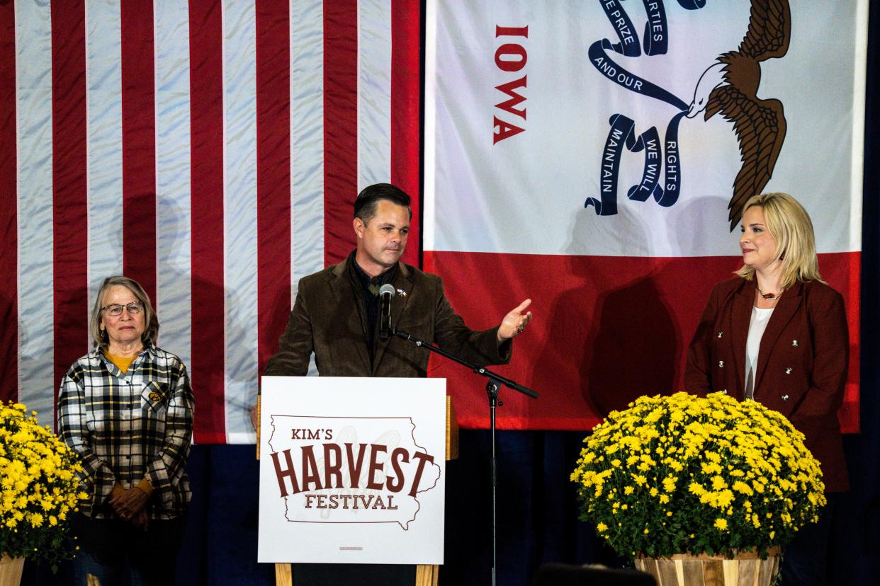 Rep. Zach Nunn, center, speaks while joined by Rep. Mariannette Miller-Meeks, left, and Rep. Ashley Hinson, right during Gov. Kim Reynolds Harvest Festival at the Elwell Family Food Center at the Iowa State Fairgrounds on Saturday, October 14, 2023 in Des Moines.