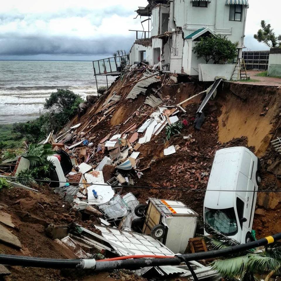 Vehicles and debris are scattered after massive flooding in Amanzimtoti, near Durban. (GAVIN WELSH)