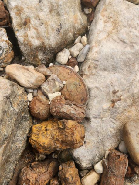 PHOTO: A Civil War union US cartridge box plate laying among the rocks of the Mississippi river below the I55 bridge.  (Courtesy Riley Bryant)