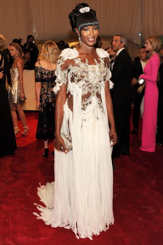 <p>Larry Busacca/Getty</p> Naomi Campbell at the 2011 Met Gala.