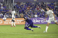 Orlando City forward Nani (17) heads a ball for a goal in front of Atlanta United midfielder Santiago Sosa, right, during the second half of an MLS soccer match, Friday, July 30, 2021, in Orlando, Fla. (Phelan M. Ebenhack/Orlando Sentinel via AP)