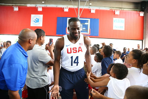 Draymond Green greets children during a recent USA Basketball event in New York City. (Nathaniel S. Butler/Getty Images)