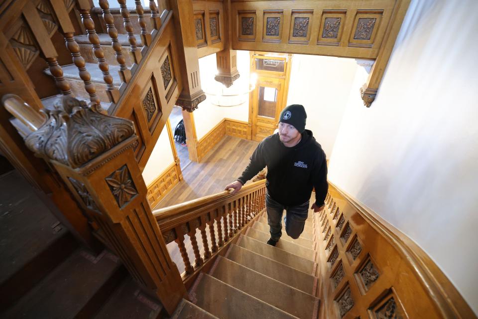 Jordan Holdaway, general manager of Other Side Academy Builders, oversees the renovation of the Armstrong Mansion in Salt Lake City on Wednesday, March 29, 2023. The organization works with former prisoners hoping to rehabilitate their lives. | Jeffrey D. Allred, Deseret News