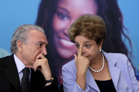 Brazil's Vice President Michel Temer talks with Brazil's President Dilma Rousseff during a ceremony for the Investment Program in Electricity at the Planalto Palace in Brasilia, August 11, 2015. REUTERS/Ueslei Marcelino