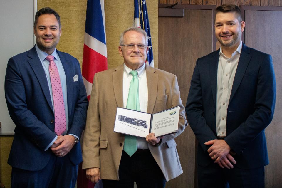 Mansfield Mayor Tim Theaker was recently presented with the Modern Woodmen of America Hometown Hero Award. From left are Brian Souder, Modern Woodmen managing partner, Theaker and Jonathan Dech, Modern Woodmen financial representative.