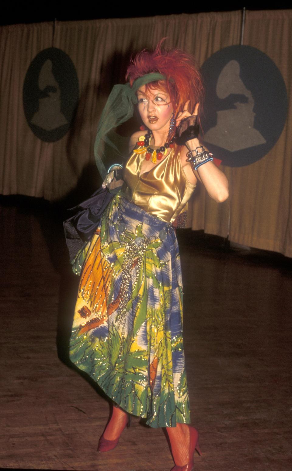 Back in 1984, before Lady Gaga was here to bless us, Cyndi Lauper was making headlines at every awards show with her out-there fashion looks, and the Grammy Awards that year were no exception. Lauper's tropical vacation gown completely fit her personal, outrageous style, and we truly <em>loved</em> to see it.