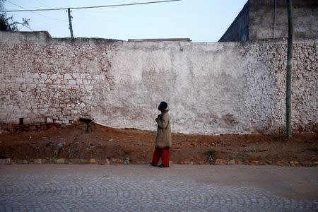 A man walks outside the walled city of Harar, Ethiopia, February 24, 2017. REUTERS/Tiksa Negeri