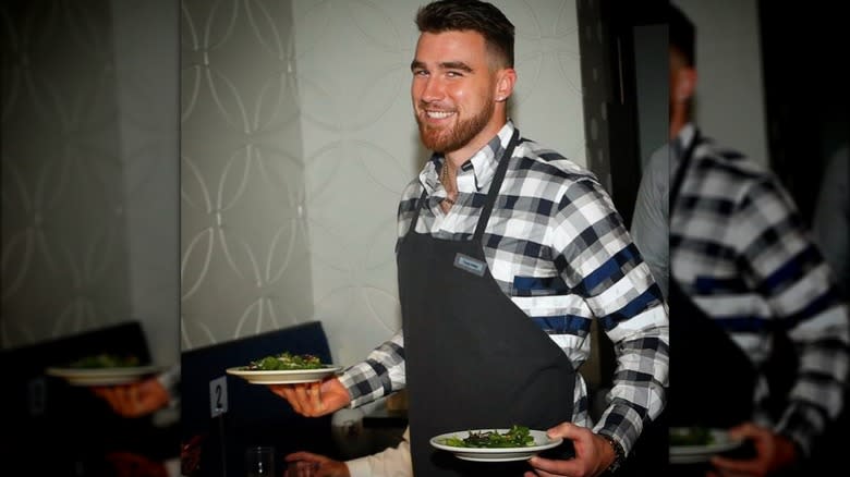 Travis Kelce with salad plates