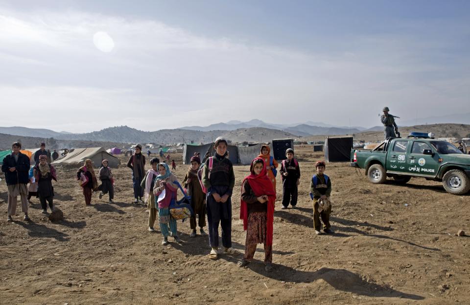 FILE- Pakistani refugee children at Gulan camp, some 20 kilometers (12 miles) from the border in the restive Khost province, Afghanistan on Jan. 19, 2015. Pakistan fired off a sharp warning Sunday, April 17, 2022, to Afghanistan's new hardline religious rulers to stop sheltering homegrown Pakistani Taliban militants, who have been staging increasingly deadly attacks against the country's military. The warning followed Afghan reports that Pakistani aircraft late Friday carried out bombing raids in Afghanistan’s eastern Khost and Kunar provinces, killing civilians. (AP Photo/Massoud Hossaini, File)