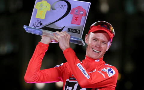 Cyclist Chris Froome, Tour de France winner, poses on the podium after winning Spain's La Vuelta cycling race - Credit: EPA