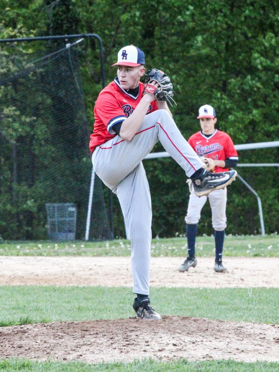 Byram Hills' Dylan Ettinger winds up for the pitch during the Bobcats' 10-2 win over Edgemont on Monday, May 1, 2023.