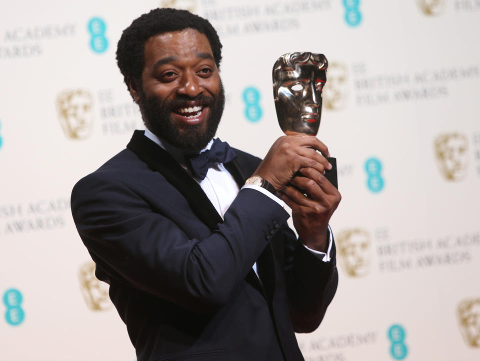 Chiwetel Ejiofor winner of best actor poses for photographers in the winners room at the EE British Academy Film Awards held at the Royal Opera House on Sunday Feb. 16, 2014, in London. (Photo by Joel Ryan/Invision/AP)