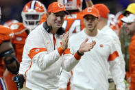 FILE - In this Jan. 13, 2020, file photo, Clemson head coach Dabo Swinney celebrates after his team scored during the second half of a NCAA College Football Playoff national championship game against LSU in New Orleans. Clemson is preseason No. 1 in The Associated Press Top 25, Monday, Aug. 24, 2020, a poll featuring nine Big Ten and Pac-12 teams that gives a glimpse at what’s already been taken from an uncertain college football fall by the pandemic. (AP Photo/David J. Phillip, File)