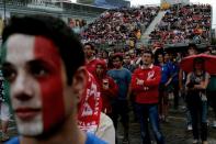 Italian and Polish fans watch the broadcast of the Euro 2012 football championships match Spain vs. Italy on June 10, 2012 in the fanzone in Warsaw . AFP PHOTO / ARIS MESSINISARIS MESSINIS/AFP/GettyImages