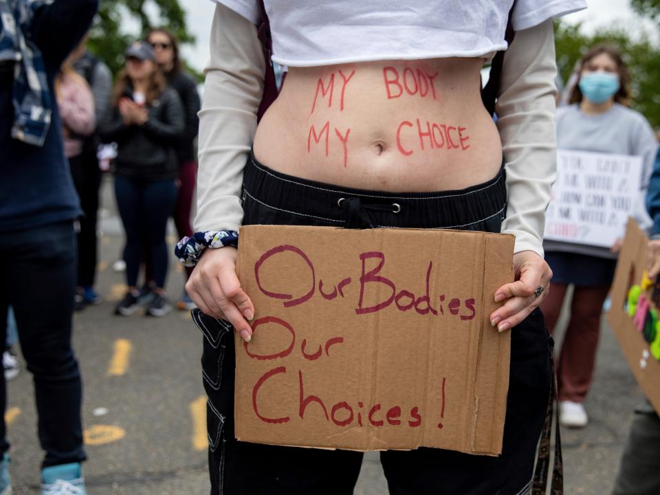 Abortion-rights protesters hold signs during a demonstration outside of the U.S. Supreme Court in Washington, Sunday, May 8, 2022. (AP Photo/Amanda Andrade-Rhoades)