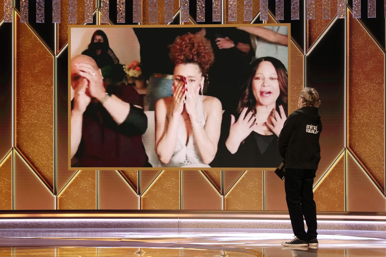 Andra Day (c) reacts after being named winner of the Best Actress - Motion Picture Drama award for &lsquo;The United States vs. Billie Holiday&rsquo; via video by Joaquin Phoenix onstage at the 78th Annual Golden Globe Awards held at The Beverly Hilton and broadcast on February 28, 2021 in Beverly Hills, California. (Photo: Christopher Polk/NBC/Getty Images)