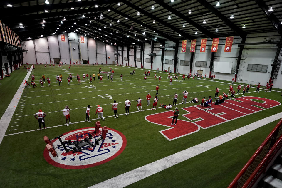 Kansas City Chiefs players stretch during an NFL football workout Wednesday, Jan. 25, 2023, in Kansas City, Mo. The Chiefs are scheduled to play the Cincinnati Bengals Sunday in the AFC championship game. (AP Photo/Charlie Riedel)