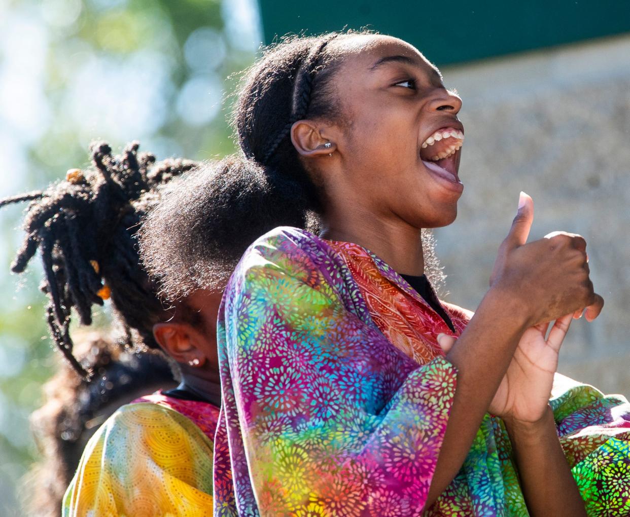 Member Mary Thompson encourages her fellow performers as the Indiana University African American Dance Company opens up the start of Lotus in the Park at Waldron, Hill and Buskirk Park as part of the 2023 Lotus World Music & Arts Festival on Saturday, Sept. 30, 2023.