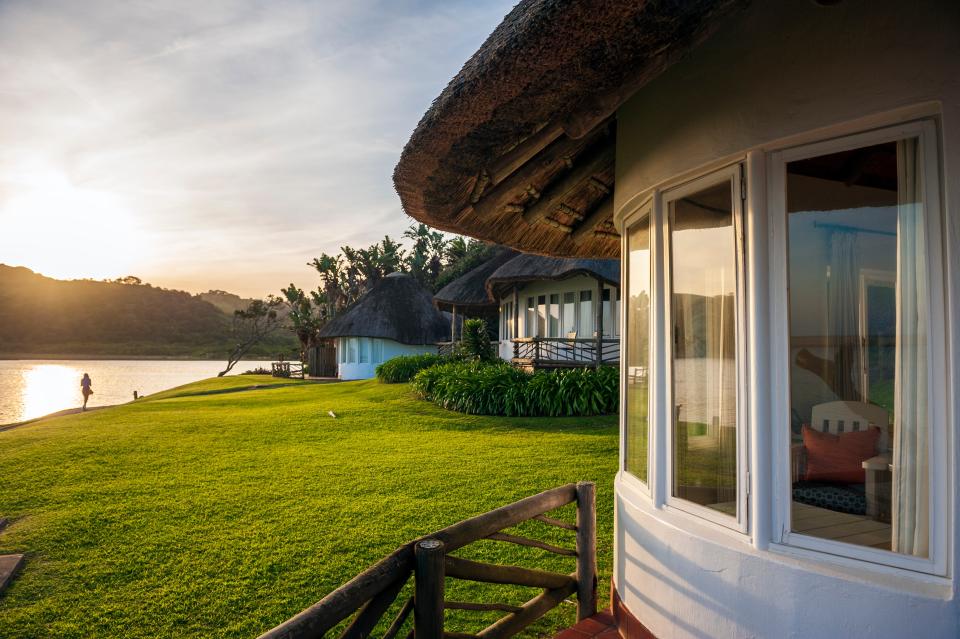 Rondavels, or southern African huts, at Umngazi River Bungalows & Spa