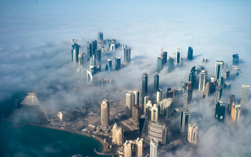 Fog shrouds Doha - Credit: EPA/YOAN VALAT