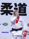 Kayla Harrison of the United States reacts in the awarding ceremony of the women's under 78 Kg category of the World Judo Championships in Tokyo, Thursday, Sept. 9, 2010. Harrison became the first American woman to win a gold medal at the judo world championships since 1984. (AP Photo/Shizuo Kambayashi)