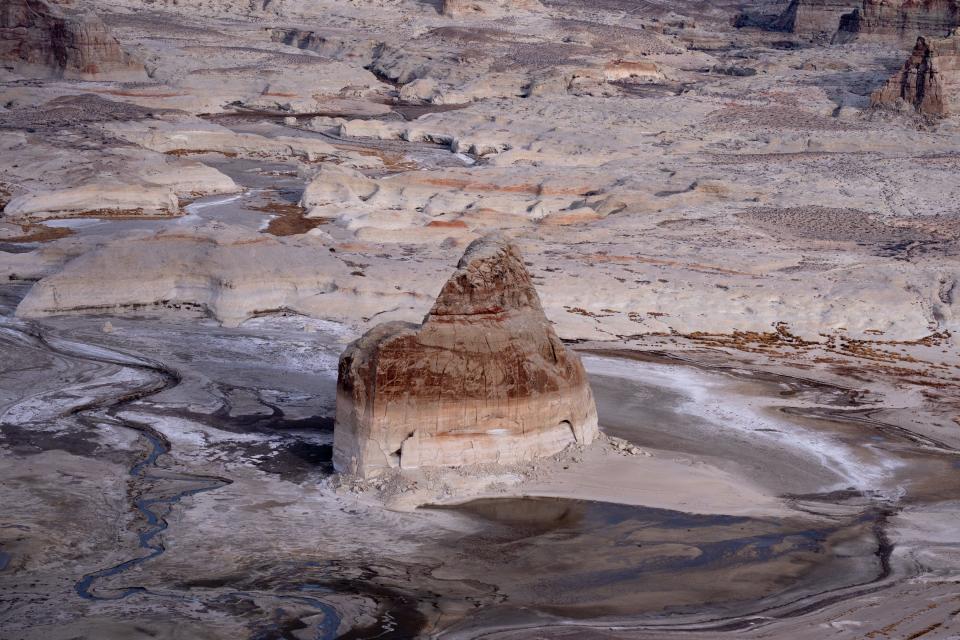 Lone Rock as seen on Feb. 1, 2022, in Lake Powell's Wahweap Bay on the Arizona/Utah border. At the time, Lake Powell was at 26% of capacity, 168 feet below its full elevation of 3,700 feet above sea level.
