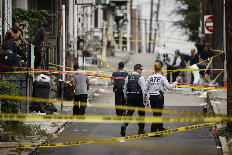 Authorities investigate the scene of Saturday's fatal car explosion in Allentown, Pa., Monday, Oct. 1, 2018. (AP Photo/Matt Rourke)