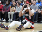 Portland Trail Blazers center Moses Brown (10) reacts after being fouled during the second half of an NBA basketball game against the Atlanta Hawks Wednesday, March 27, 2024, in Atlanta. (AP Photo/John Bazemore)