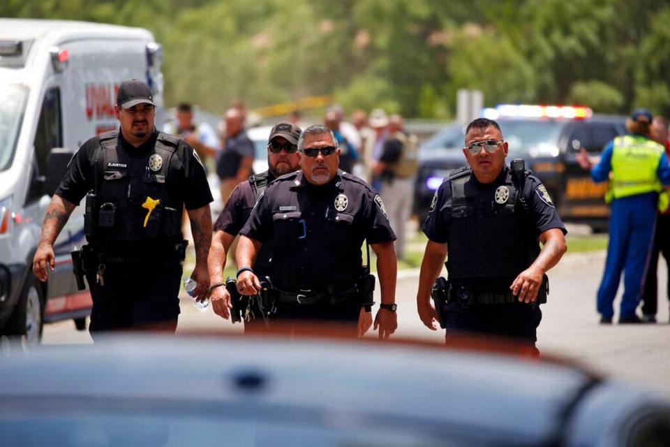 Police walk near Robb Elementary School following a shooting, Tuesday, May 24, 2022, in Uvalde, Texas. (AP Photo/Dario Lopez-Mills)