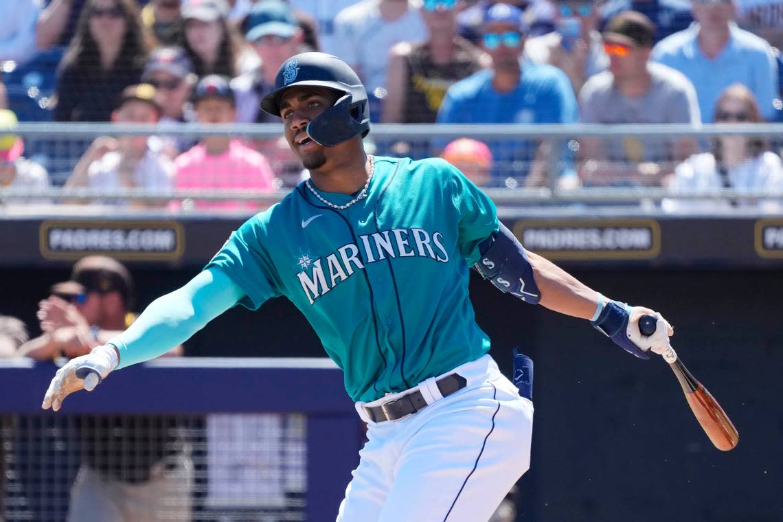 Seattle Mariners’ Julio Rodriguez fouls off a pitch against the San Diego Padres during the first inning of a spring training baseball game Monday, March 27, 2023, in Peoria, Arizona.