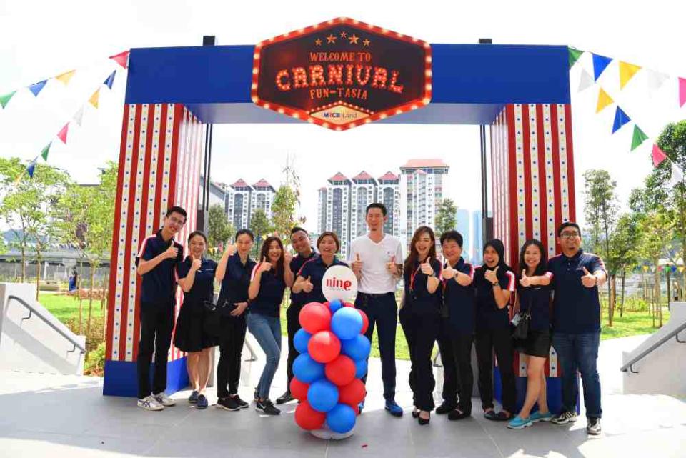 MRCB Land chief executive officer Raymond Cheah (in white) with the MRCB Land team at the launch of Carnival Fun-Tasia at 9 Seputeh Condominium. — Picture courtesy of MRCB Land