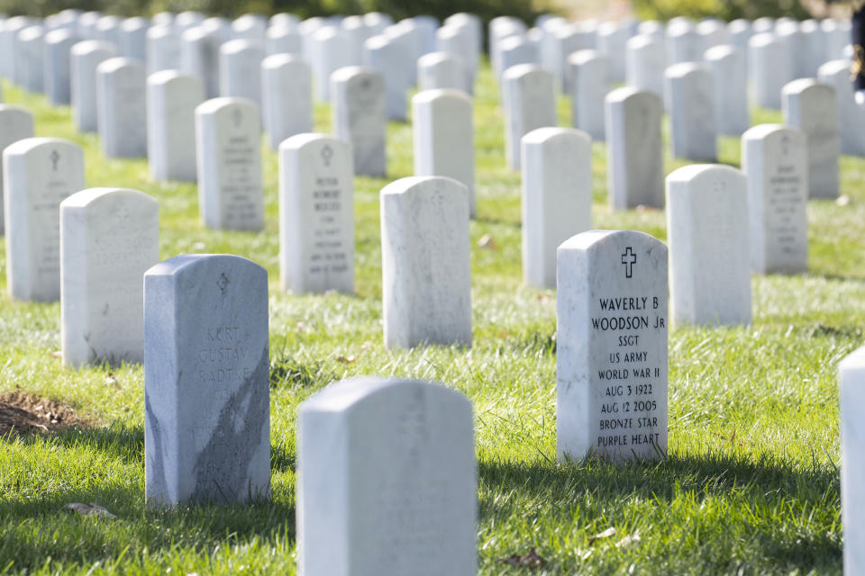 FILE - The headstone of Cpl. Waverly B. Woodson Jr. is seen during a ceremony at Arlington National Cemetery, Oct. 11, 2023, in Arlington, Va. Woodson Jr., a medic who was part of the only Black combat unit to take part in the D-Day invasion of France, is being posthumously awarded the Distinguished Service Cross. It's the military's second highest honor. The announcement was made Monday, June 3, 2024, by Sen. Chris Van Hollen of Maryland. (AP Photo/Kevin Wolf, File)