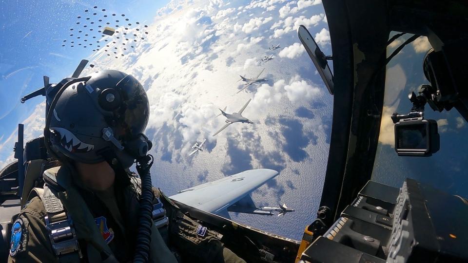 U.S. Air Force Capt. Coleen Berryhill, 74th Fighter Squadron A-10C Thunderbolt II pilot, flies near a formation of B1-B Lancer and A-10 Thunderbolt II above the Philippine Sea, Nov. 9, 2022.