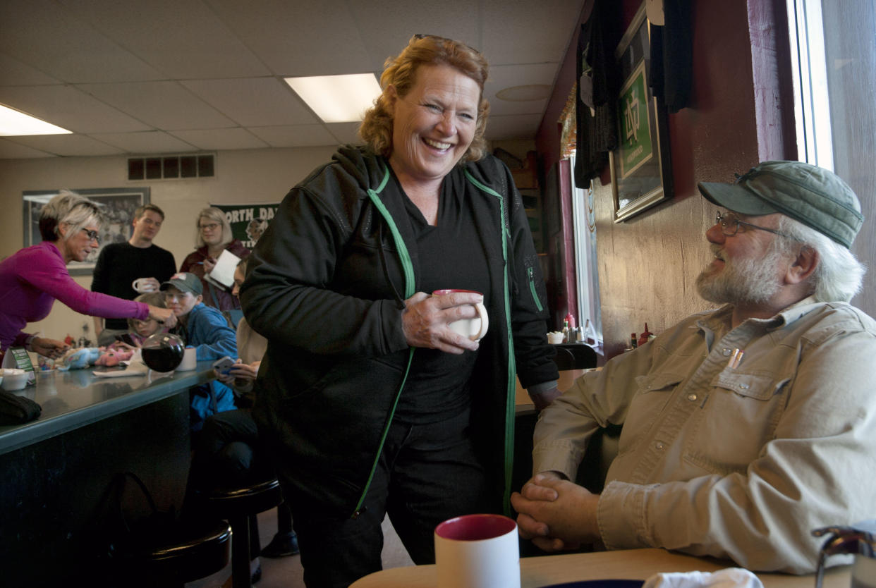 Sen. Heidi Heitkamp, D-N.D., talks with a constituent at Darcy’s Cafe while campaigning for reelection in Grand Forks in September. (Photo: Bruce Crummy/AP)