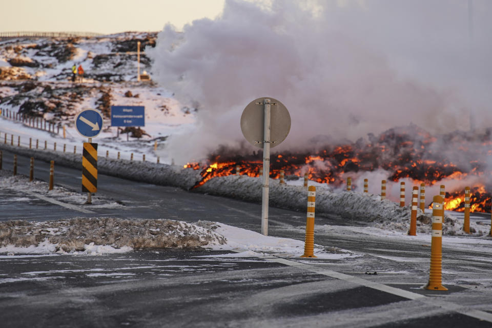 Lava spills near to the road to Grindavík, close to the exit for the blue lagoon, in Grindavík, Iceland, Thursday, Feb. 8, 2024. A volcano in southwestern Iceland has erupted for the third time since December and sent jets of lava into the sky. The eruption on Thursday morning triggered the evacuation the Blue Lagoon spa which is one of the island nation’s biggest tourist attractions. (AP Photo /Marco Di Marco)