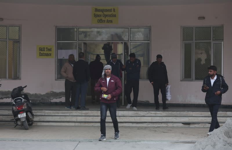 Skilled workers leave a building after their skill test at a Haryana state government recruitment drive to send workers to Israel, at Maharshi Dayanand University in Rohtak