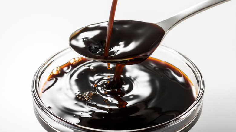 Worcestershire sauce pouring into a bowl