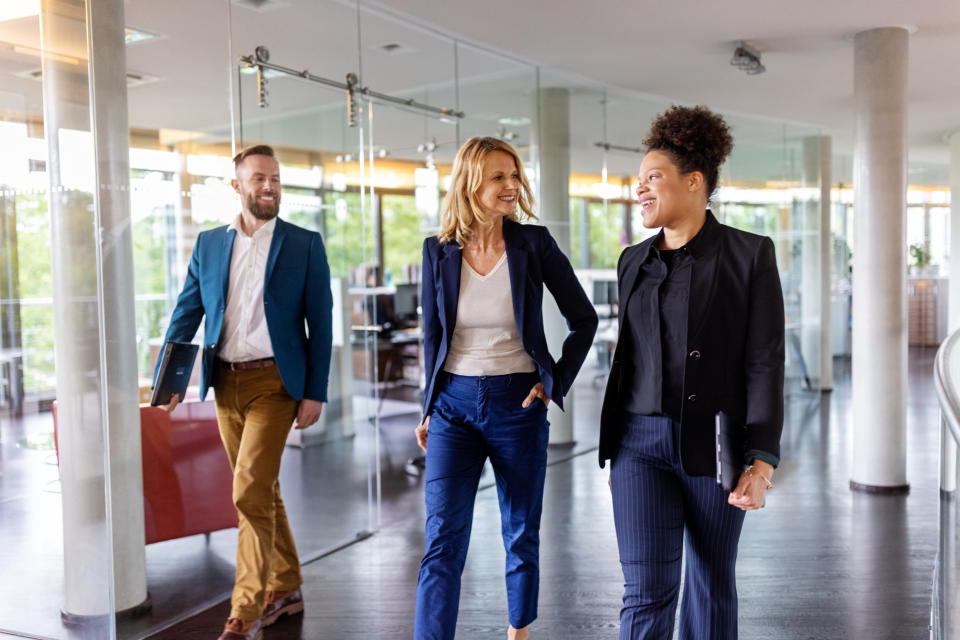 office workers wearing blazers and slacks