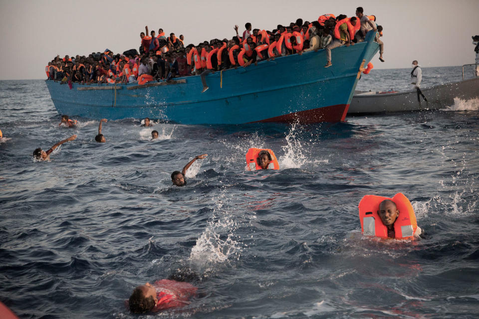 Migrants swim to rescuers off the Libyan coast