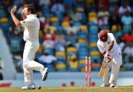 Australian cricketer Ben Hilfenhaus (L) celebrates after bowling out West Indies batsman Adrian Barath (R) during the fourth day of the first-of-three Test matches between Australia and West Indies at the Kensington Oval stadium in Bridgetown on April 10, 2012. Australia trailed by 43 runs at the end of the first innings. AFP PHOTO/Jewel Samad (Photo credit should read JEWEL SAMAD/AFP/Getty Images)