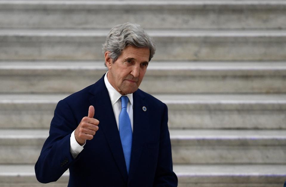 US Special Presidential Envoy for Climate John Kerry (L) gives a thumbs up whilst meeting with Italy's Ecological Transition Minister Roberto Cingolani at Palazzo Reale for the climate and energy G20 meeting in the historical centre of Naples on July 23, 2021. (Photo by Filippo MONTEFORTE / AFP) (Photo by FILIPPO MONTEFORTE/AFP via Getty Images)