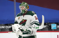 Minnesota Wild goaltender Kaapo Kahkonen skates back to the net after a time out in the first period of an NHL hockey game against the Colorado Avalanche Wednesday, Feb. 24, 2021, in Denver. (AP Photo/David Zalubowski)