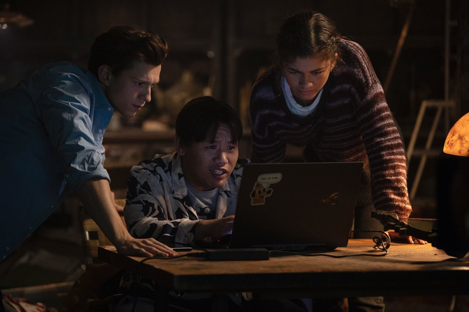 Peter, Ned, and MJ look at a computer