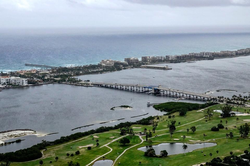Lake Worth Beach Golf Club (foreground) and bridge. The William O. Lockhart Municipal Pier can be seen at left.
