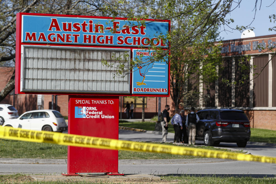 Knoxville police work the scene of a shooting at Austin-East Magnet High School Monday, April 12, 2021, in Knoxville, Tenn. (AP Photo/Wade Payne)