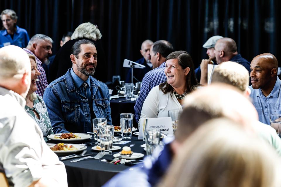 Green Bay Packers quarterback Aaron Rodgers spends time with fans Wednesday during the team's Welcome Back Luncheon sponsored by the Greater Green Bay Chamber.