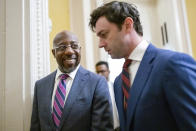 Sen. Raphael Warnock, D-Ga., left, and Sen. Jon Ossoff, D-Ga., leave a Democratic Caucus leadership meeting at the Capitol in Washington, Thursday, Dec. 8, 2022. With Warnock's runoff victory over Republican challenger Herschel Walker this week, the Democrats in the Senate now have a 51-49 majority and Senate Majority Leader Chuck Schumer, D-N.Y., will no longer have to negotiate a power-sharing deal with Republicans and won't have to rely on Vice President Kamala Harris to break as many tie votes. (AP Photo/J. Scott Applewhite)